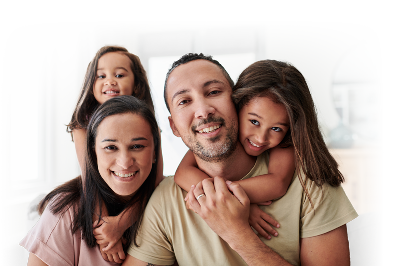 family smiling at camera