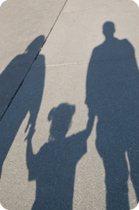 Shadows of a family holding hands