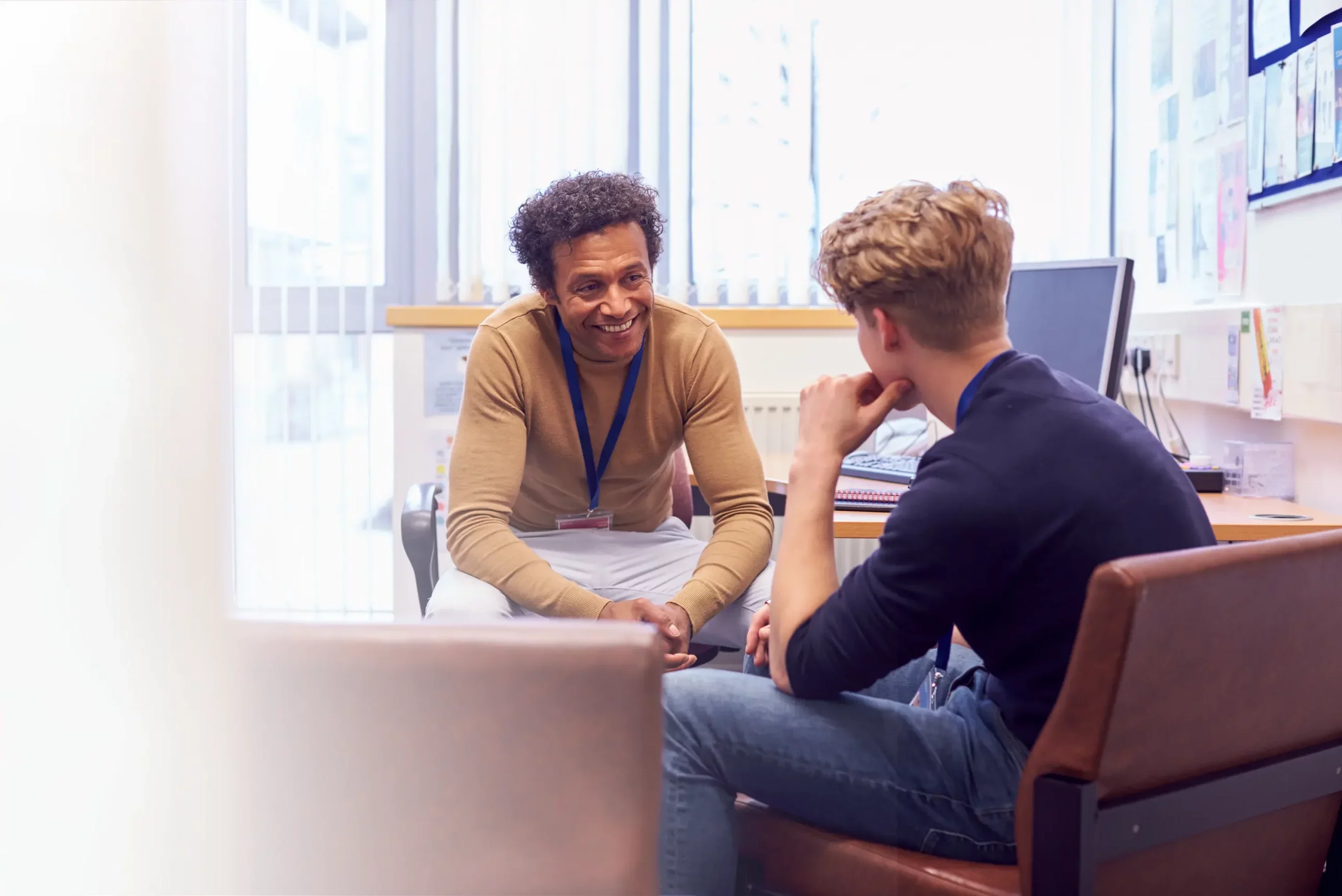 Teenage boy speaking with a therapist