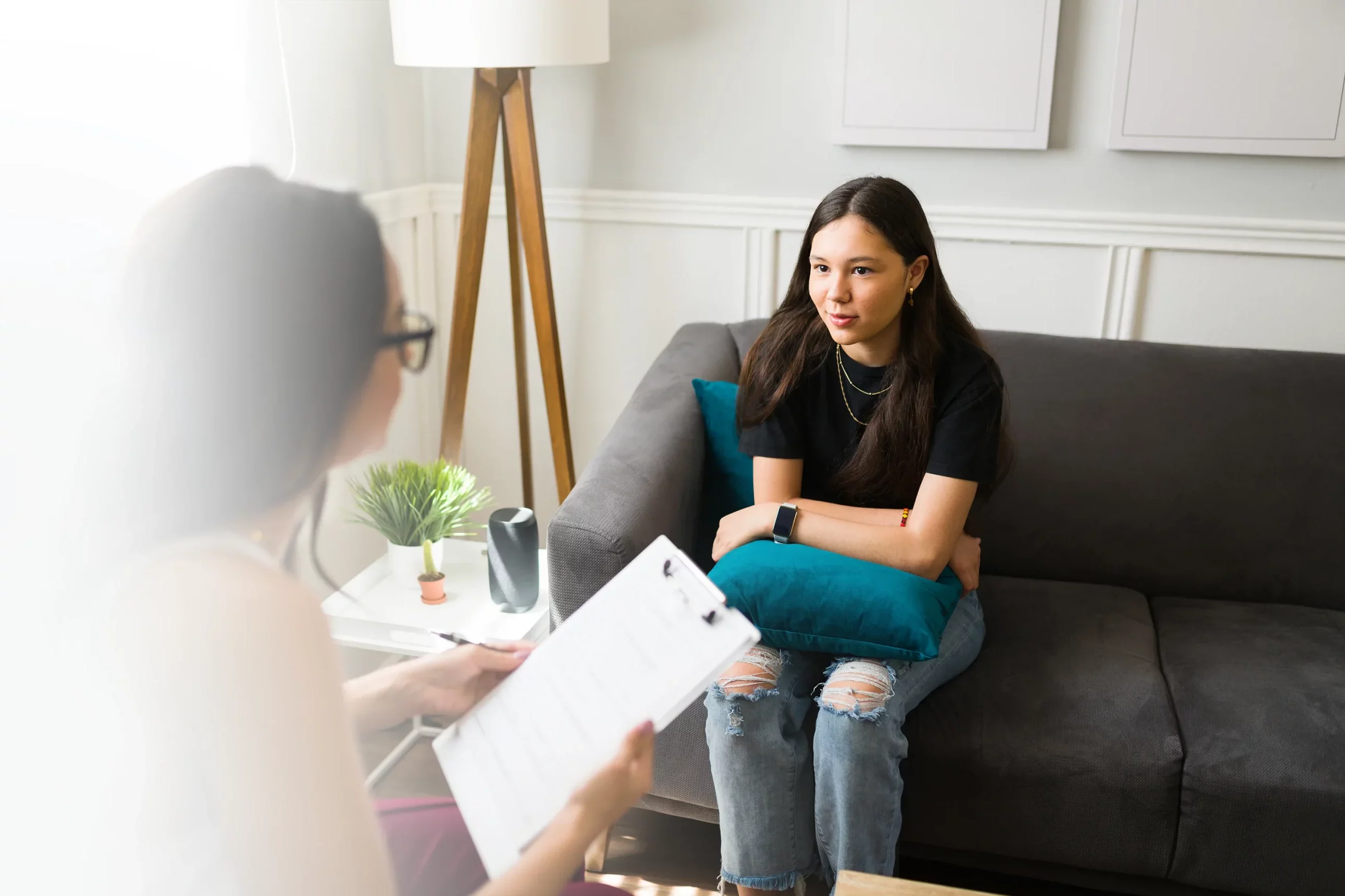 Teenage girl speaking with social worker