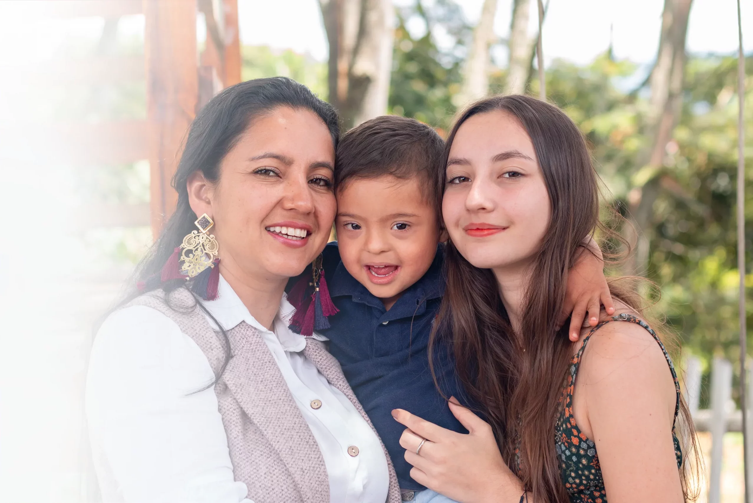 Mother holding her daughter and son