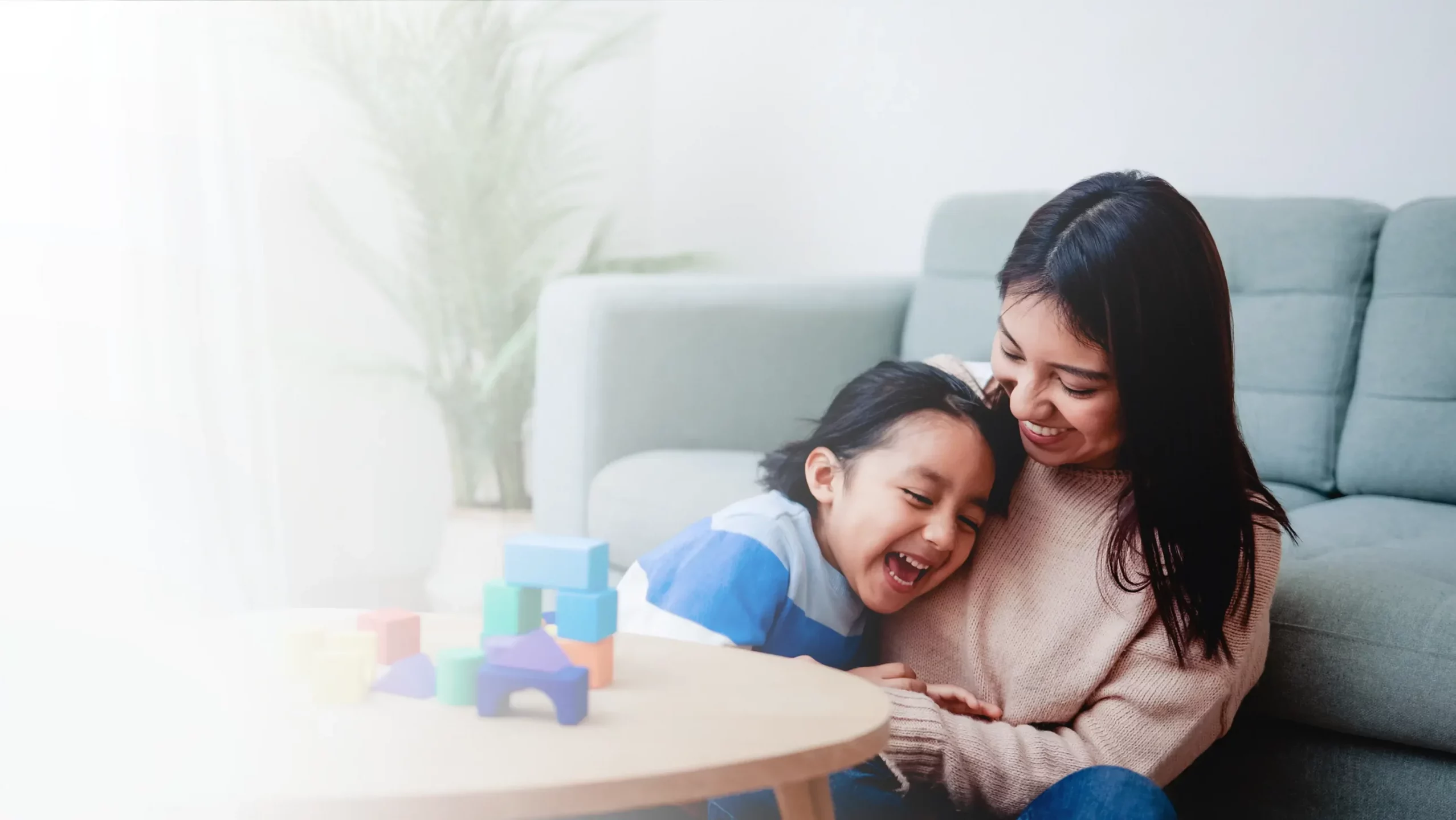 Mother and child laughing together