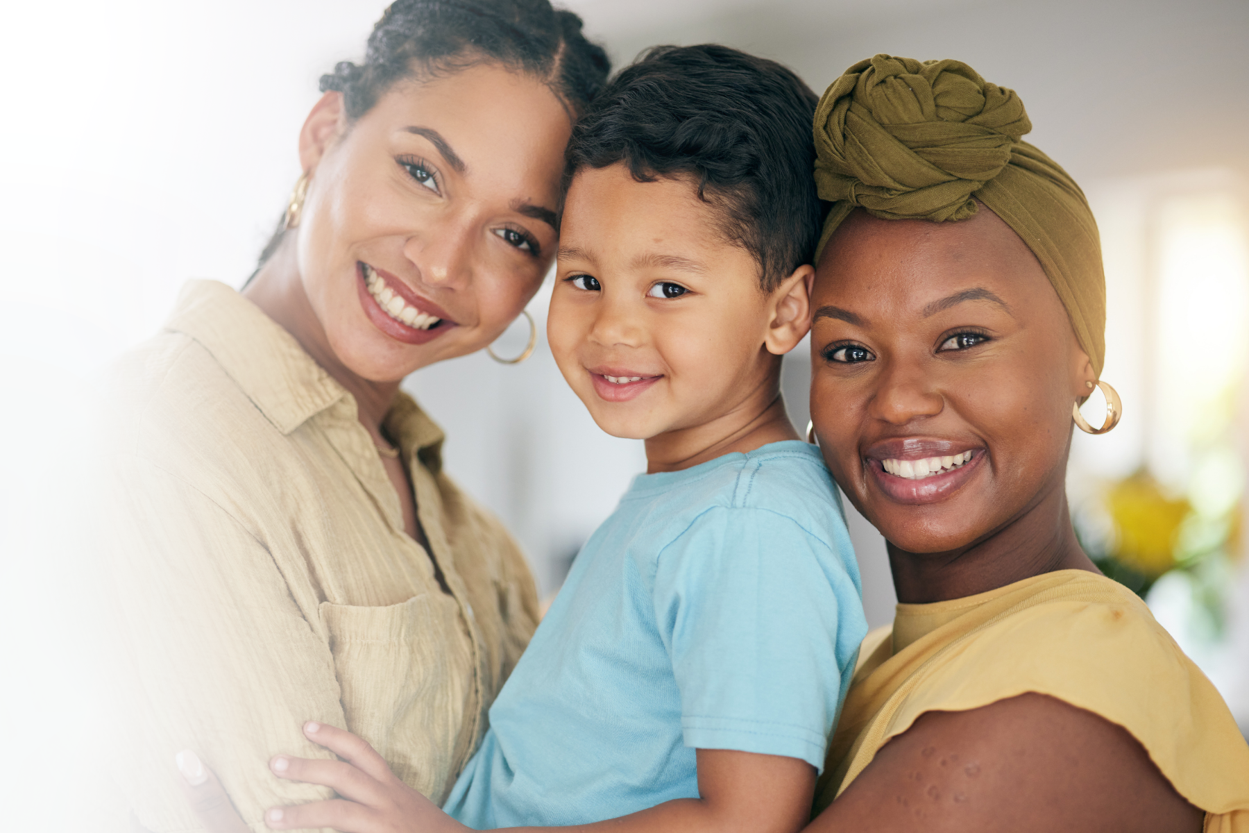 Two mothers with adopted little boy